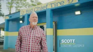 big chief customer standing in front of big chief tire