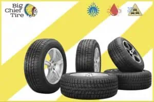 stack of tires cutout on yellow and white stripped background