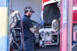 tech performing a vehicle inspection